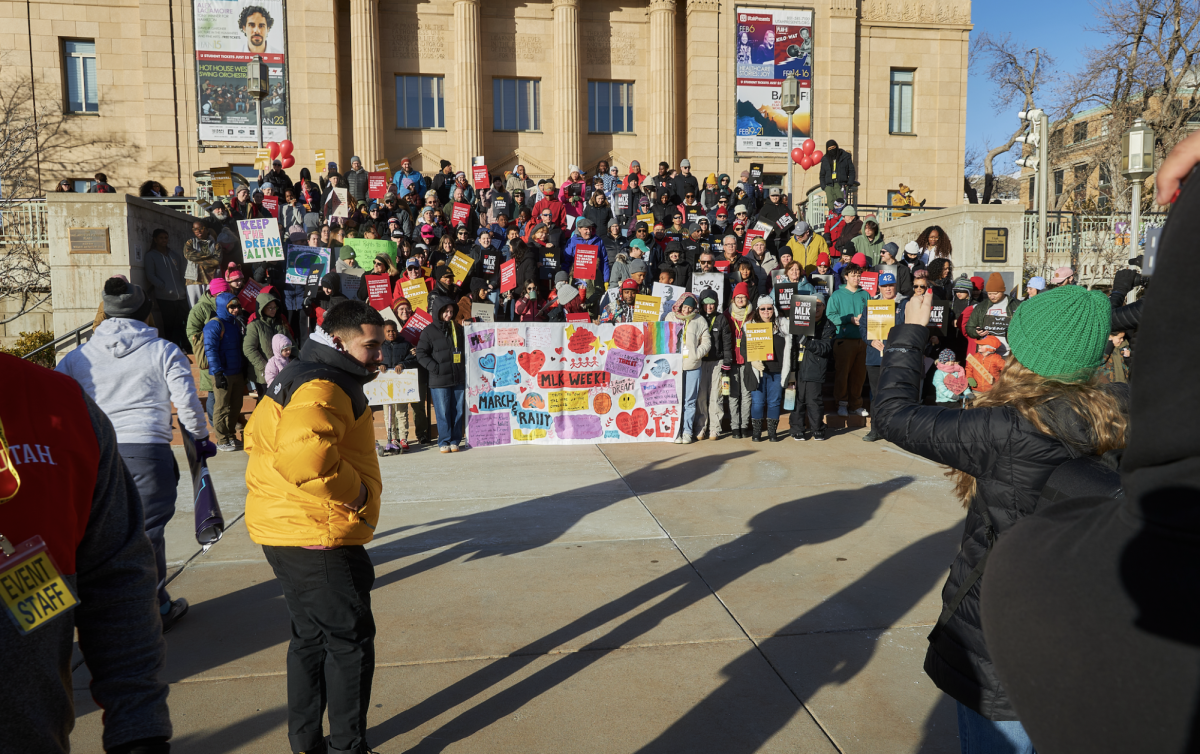 Attendees of the MLK rally and march gather outside of Kingsbury Hall on Monday, Jan. 20, 2025. (Photo by Luke Larsen | The Daily Utah Chronicle)